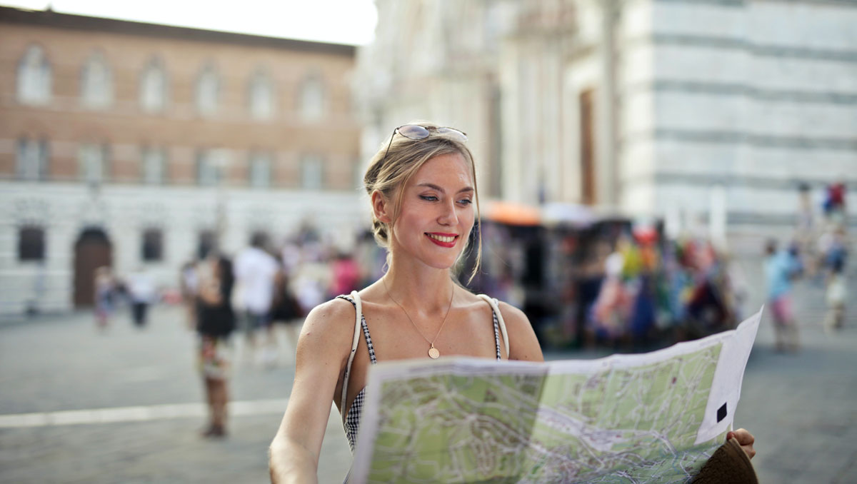 Woman holding a map of a city