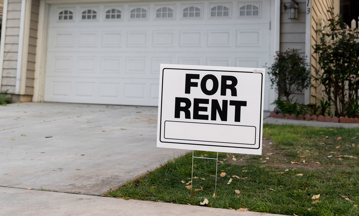 House with yard sign for rent