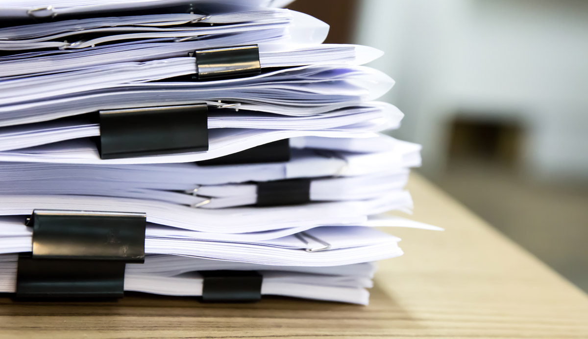 Pile of documents on desk
