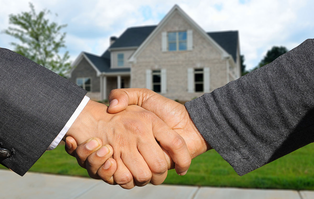 Landlord and renter shaking hands