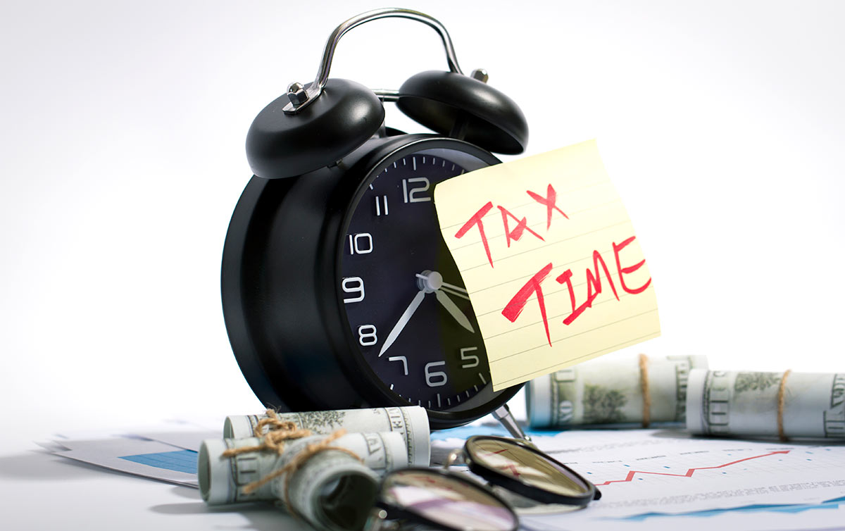 High angle view of clock and currency on table