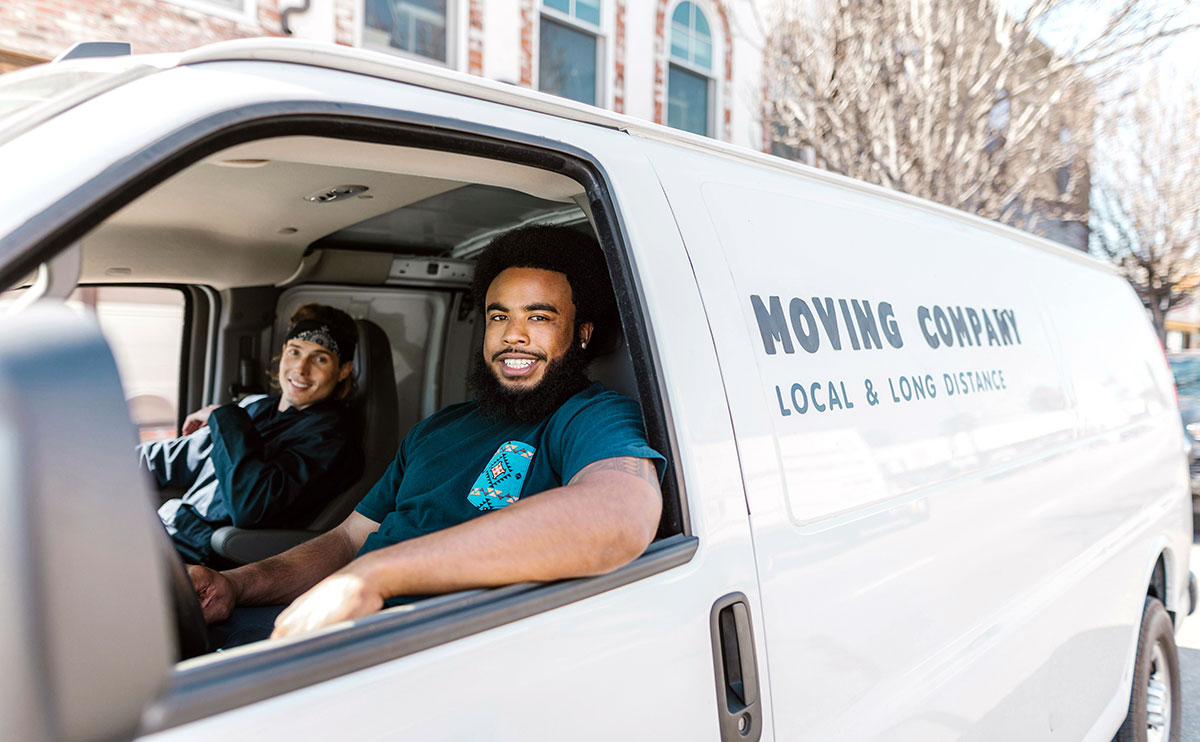 Professional movers in a van.