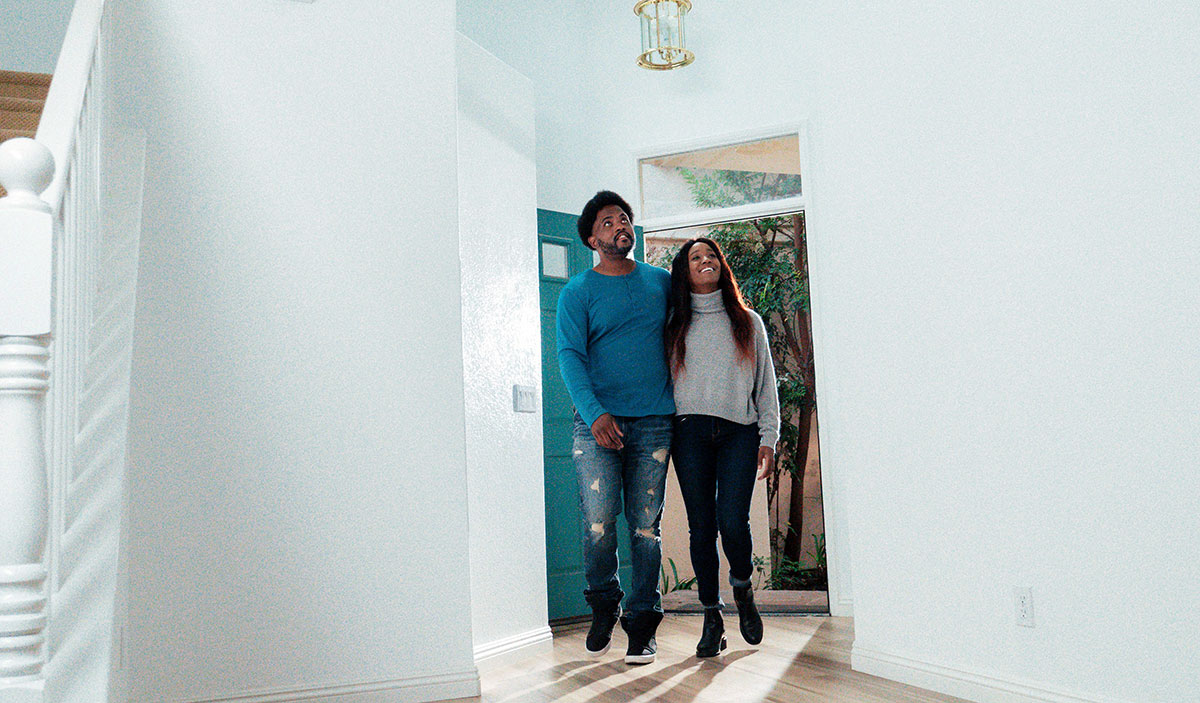 Couple looking at a house.