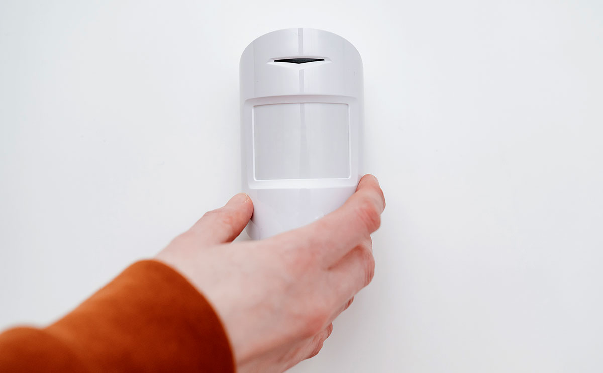 Motion sensor in hand on white