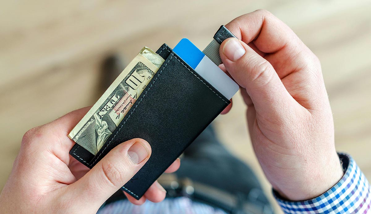 Person Holding Black Card Holder