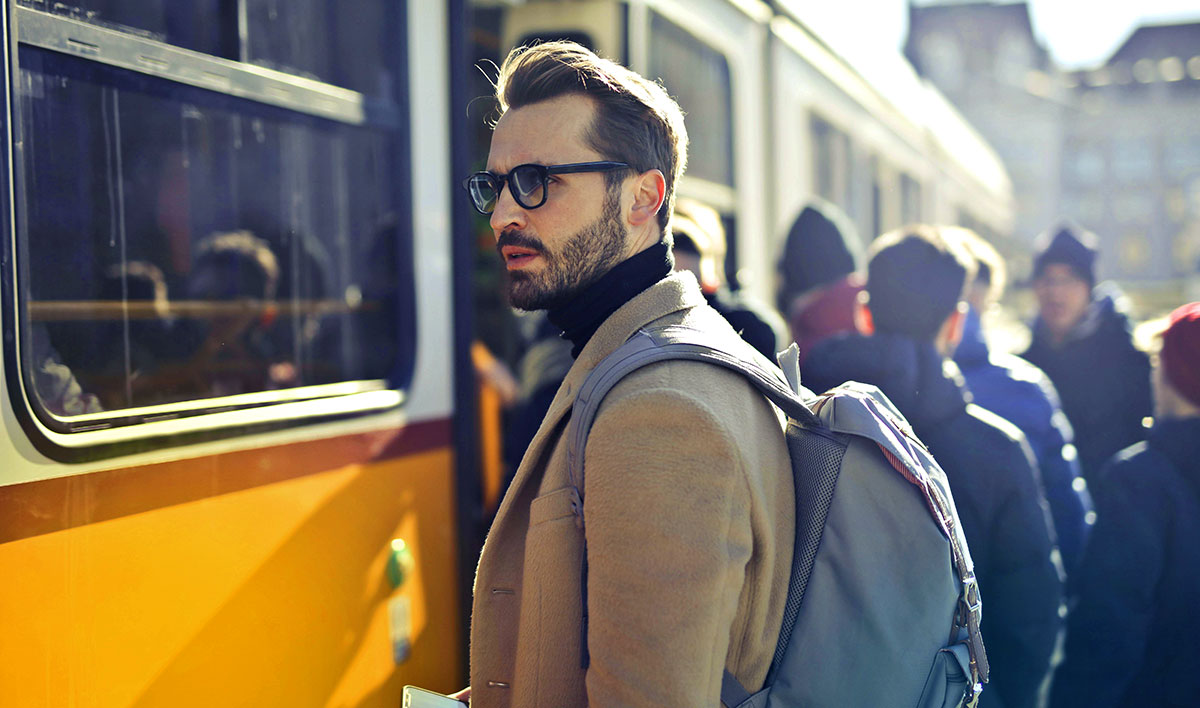 A person standing at the bus stop