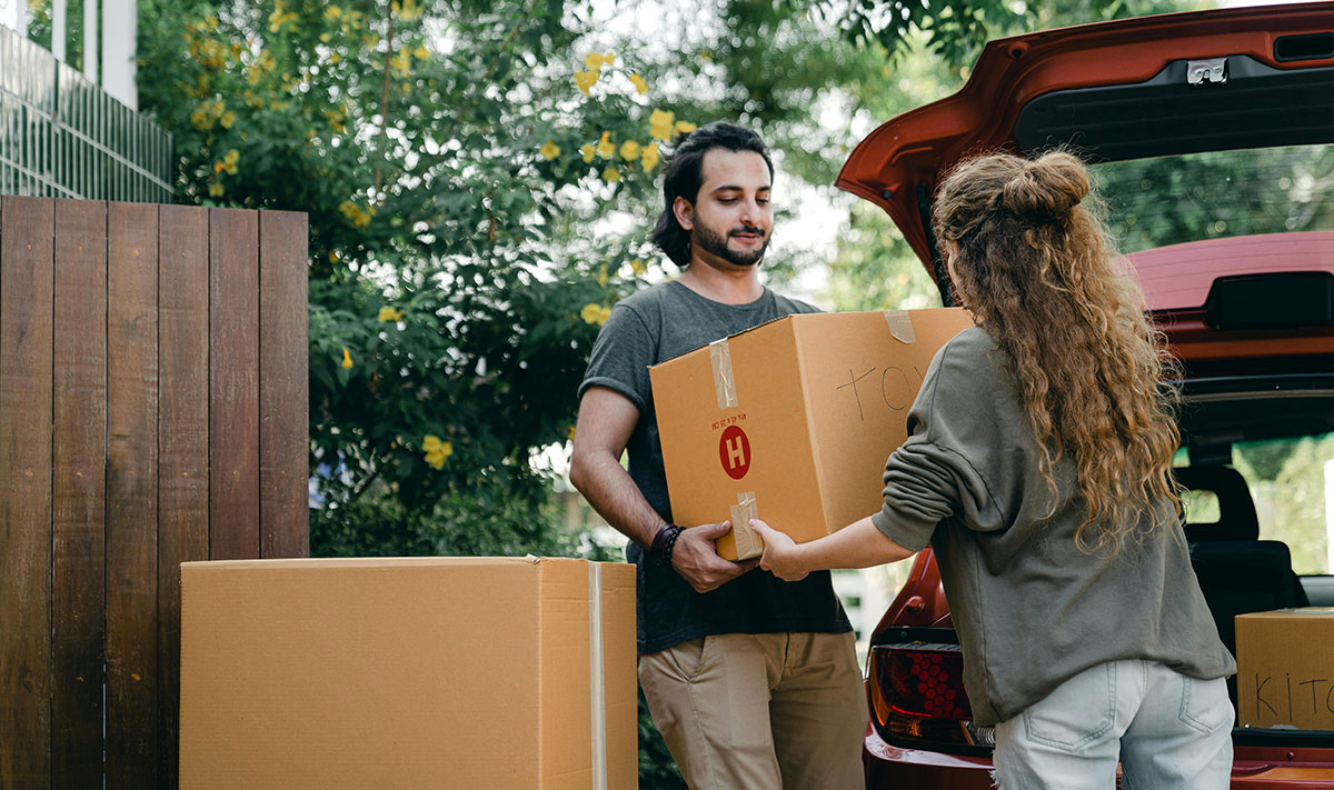 A couple unloading their things
