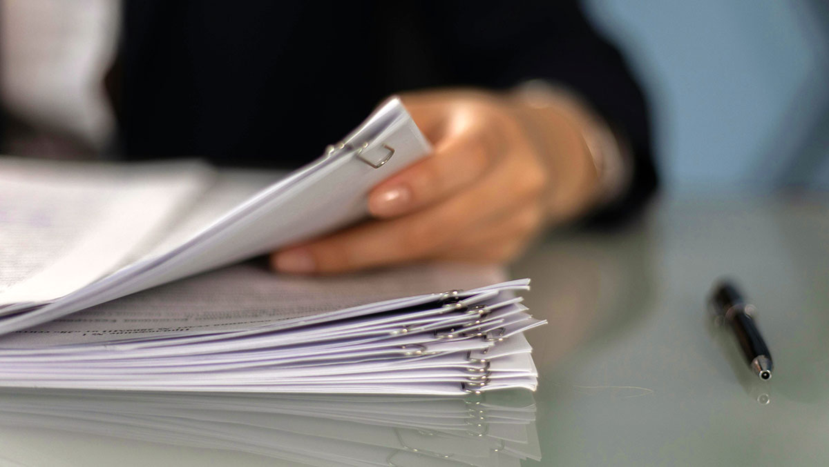 A person holding documents