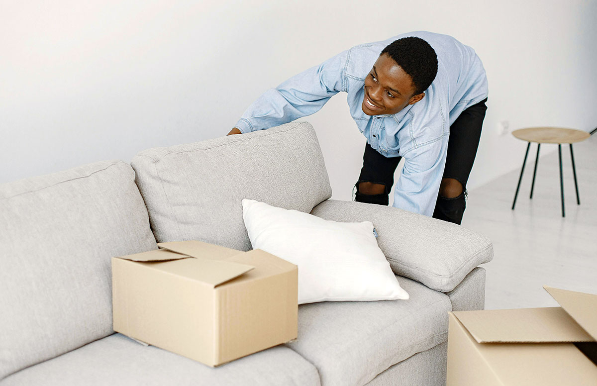 man moving couch